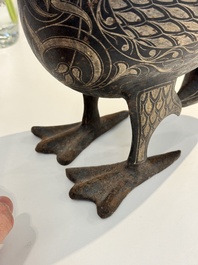 A large Qajar damascened steel bird-form sculpture, Persia, 19th C.