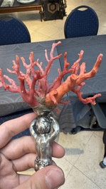 A red coral mounted silver figure, possibly Germany, 19th C.