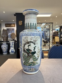 A Chinese blue, white and famille verte rouleau vase with figural and peacock design, Qianlong mark, 19th C.