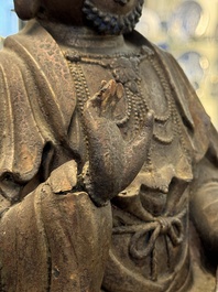 A rare Chinese dry lacquer figure of a Luohan, Ming