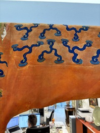 A Chinese embroidered silk salmon-ground 'dragon' robe, 19th C.