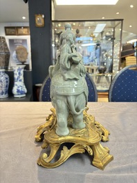 * A gilt-bronze-mounted celadon-glazed group of three figures riding an elephant, probably Samson, Paris, 19th C.