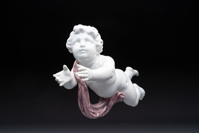 A pair of manganese and white Delftware putti, France or Germany, 19th C.