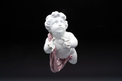 A pair of manganese and white Delftware putti, France or Germany, 19th C.