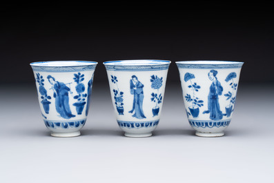 Three Chinese blue and white 'Elegant Beauties' cups and saucers, Chenghua and jade marks, Kangxi