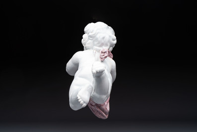 A pair of manganese and white Delftware putti, France or Germany, 19th C.