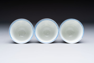 Three Chinese blue and white 'Elegant Beauties' cups and saucers, Chenghua and jade marks, Kangxi