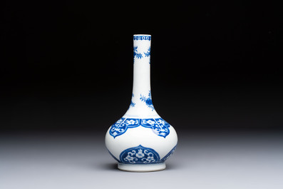Three Chinese blue and white 'Fish' bowls and a bottle vase, Kangxi marks, 19th C.