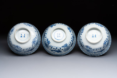 Three Chinese blue and white 'Fish' bowls and a bottle vase, Kangxi marks, 19th C.
