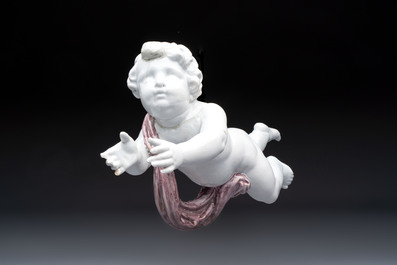 A pair of manganese and white Delftware putti, France or Germany, 19th C.