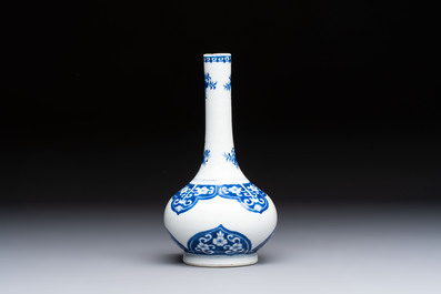 Three Chinese blue and white 'Fish' bowls and a bottle vase, Kangxi marks, 19th C.