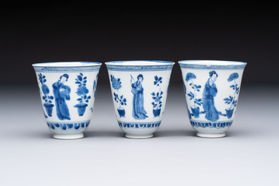 Three Chinese blue and white 'Elegant Beauties' cups and saucers, Chenghua and jade marks, Kangxi