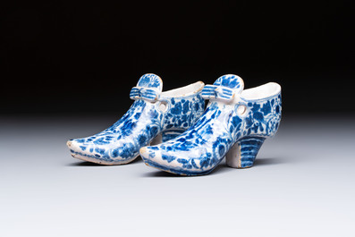 A pair of blue and white Delftware shoes with floral design, France, 18th C.