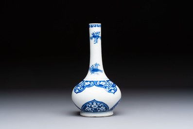 Three Chinese blue and white 'Fish' bowls and a bottle vase, Kangxi marks, 19th C.