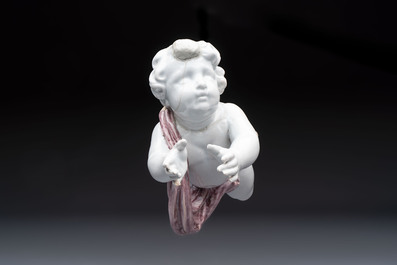 A pair of manganese and white Delftware putti, France or Germany, 19th C.