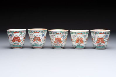 Five Chinese famille verte cups and saucers with floral design, 19th C.