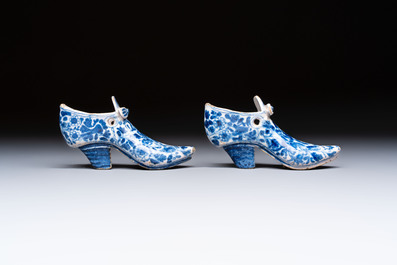 A pair of blue and white Delftware shoes with floral design, France, 18th C.