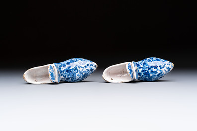 A pair of blue and white Delftware shoes with floral design, France, 18th C.
