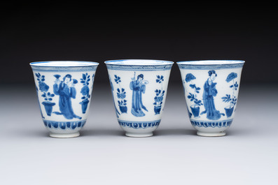 Three Chinese blue and white 'Elegant Beauties' cups and saucers, Chenghua and jade marks, Kangxi