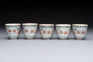 Five Chinese famille verte cups and saucers with floral design, 19th C.