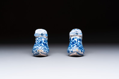 A pair of blue and white Delftware shoes with floral design, France, 18th C.