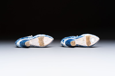 A pair of blue and white Delftware shoes with floral design, France, 18th C.