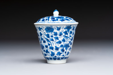 A Chinese blue and white covered ewer, a rose water sprinkler, a covered cup and saucer, jade 玉 and twin-fish mark, Kangxi