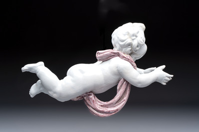 A pair of manganese and white Delftware putti, France or Germany, 19th C.