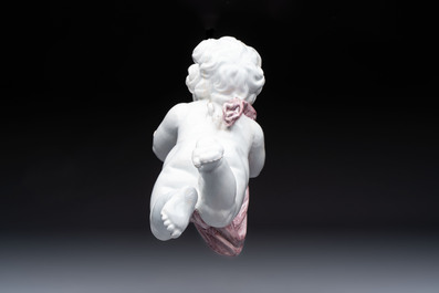 A pair of manganese and white Delftware putti, France or Germany, 19th C.