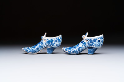 A pair of blue and white Delftware shoes with floral design, France, 18th C.