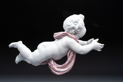 A pair of manganese and white Delftware putti, France or Germany, 19th C.