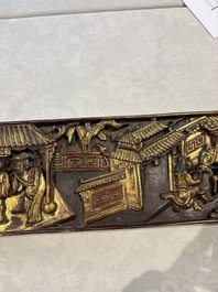 Six Chinese gilt-lacquered carved wooden panels with narrative design, 19th C.