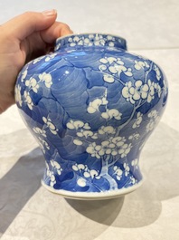 Two pairs of Chinese blue and white covered vases and a large covered vase, 19th C.