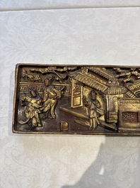 Six Chinese gilt-lacquered carved wooden panels with narrative design, 19th C.