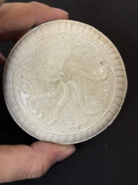 Nine Chinese white-glazed boxes and covers with incised floral design from the Jepara shipwreck, Dehua or Anxi kiln, Song