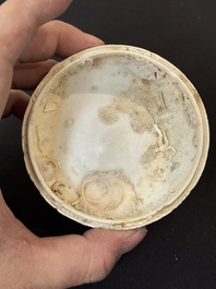 Nine Chinese white-glazed boxes and covers with incised floral design from the Jepara shipwreck, Dehua or Anxi kiln, Song