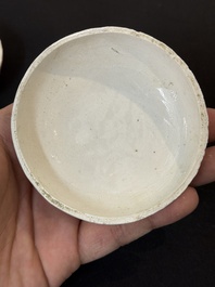 Nine Chinese white-glazed boxes and covers with incised floral design from the Jepara shipwreck, Dehua or Anxi kiln, Song