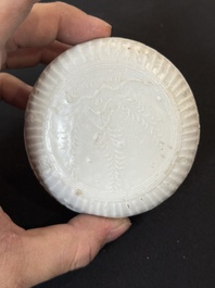 Nine Chinese white-glazed boxes and covers with incised floral design from the Jepara shipwreck, Dehua or Anxi kiln, Song