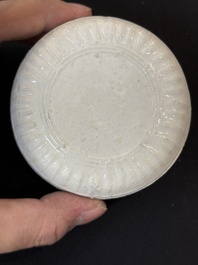 Nine Chinese white-glazed boxes and covers with incised floral design from the Jepara shipwreck, Dehua or Anxi kiln, Song