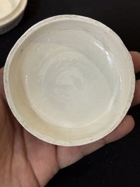 Nine Chinese white-glazed boxes and covers with incised floral design from the Jepara shipwreck, Dehua or Anxi kiln, Song