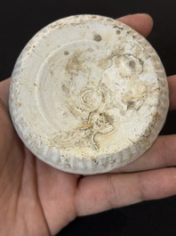 Nine Chinese white-glazed boxes and covers with incised floral design from the Jepara shipwreck, Dehua or Anxi kiln, Song