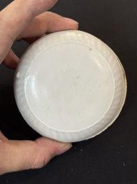 Nine Chinese white-glazed boxes and covers with incised floral design from the Jepara shipwreck, Dehua or Anxi kiln, Song