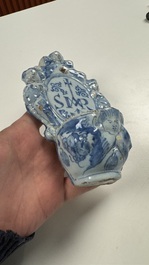Two blue and white Dutch Delft holy water fonts, 17th C.