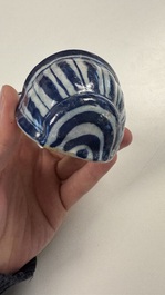 Two blue and white Dutch Delft holy water fonts, 17th C.