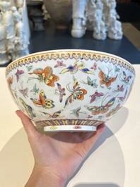 A Chinese grisaille coral red-ground vase, a famille rose eggshell vase and two bowls, Qianlong mark, 20th C.