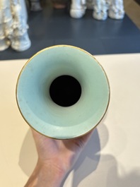 A Chinese grisaille coral red-ground vase, a famille rose eggshell vase and two bowls, Qianlong mark, 20th C.