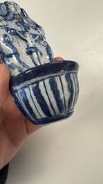 Two blue and white Dutch Delft holy water fonts, 17th C.