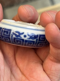 A fine Chinese archaistic blue and white bird feeder with chilong design, Qianlong mark and of the period