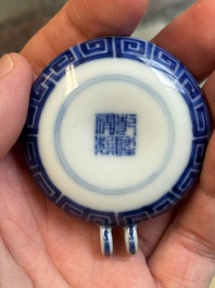 A fine Chinese archaistic blue and white bird feeder with chilong design, Qianlong mark and of the period