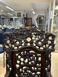 A richly carved Chinese hongmu 'dragon' armchair, Canton, 19th C.
